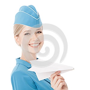 Charming Stewardess Holding Paper Plane In Hand Isolated On White