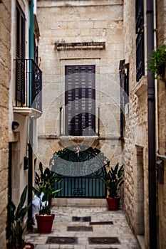 Charming Italian Balconies: Old Buildings Adorned with Balconies in a Typical Polignano a Mare Street photo