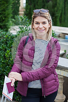 Charming tourist with map