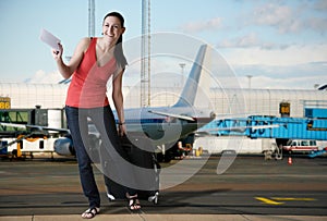 Charming tourist woman in airport ready for boarding