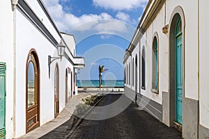 Traditional street with whitewashed houses and colorful windows and doors in Arrecife, Lanzarote, Canary Islands, Spain