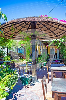 Charming traditional taverna outdoor seating Kamari Santorini Greece