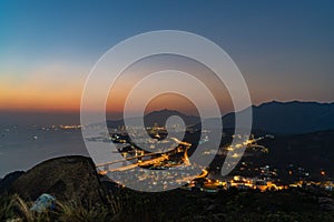 Charming view of Tuen Mun or Castle Peak in Hong Kong at vibrant sunset, China