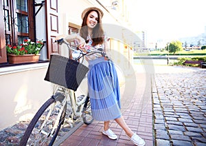 Charming woman on bike in city, during summer