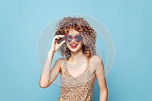 Charming woman hand gestures on a blue background