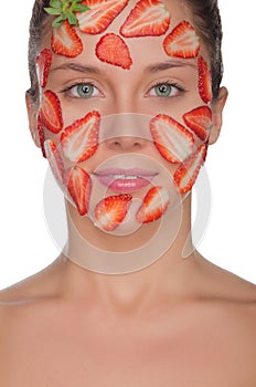 Charming woman with mask of strawberries