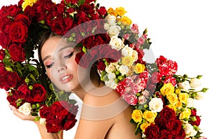 Charming woman with roses on white