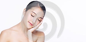 Charming woman touching her face with clean fresh skin while close eye relax over isolated white background. Beauty