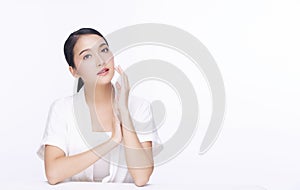 Charming woman touching her face with clean fresh skin. Teenager with perfect skin over isolated white background. Beauty