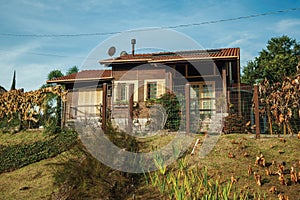 Countryside wood house with fence and garden