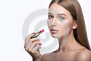 Charming young babe with lipstick and light makeup.