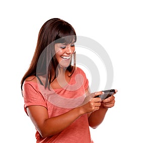 Charming young female sending message by cellphone