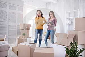 Charming young girls contacting removers company