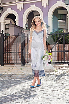 Charming young lady posing outdoors