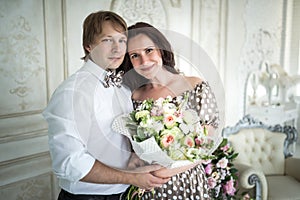 Charming young married couple with roses