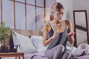 Charming young woman being ready to take pills