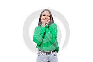 charming young 30 year old european brunette woman model with long hair and brown eyes dressed in casual green shirt