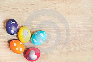 Charmingly colorfully decorated Easter eggs with child's paintings. Funny festive preoccupations