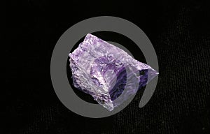 Charoite Stone against Black Background