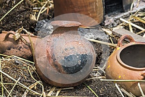 Charred clay pot