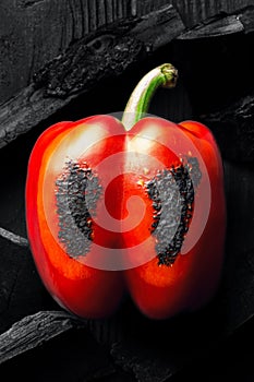 Charred red bell pepper with coals