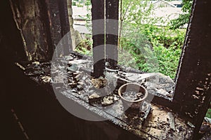 Charred window in a burnt house, inside view