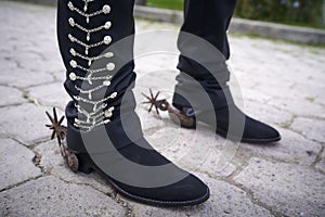 Charro boots and traditional suit photo