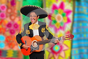 Charro Mariachi playing guitar serape poncho photo