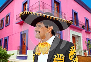Charro mexican Mariachi portrait in pink house photo