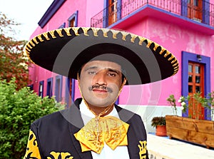 Charro mexican Mariachi portrait in pink house photo
