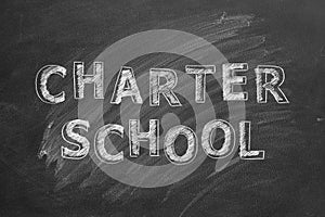 Charter school. Text on blackboard