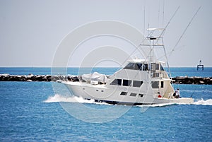 Charter Sport Fishing Boat Heading Out to Sea photo