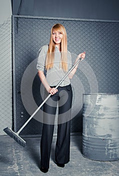 Charwoman with broom photo