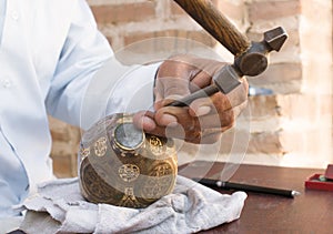 Chaser of copper at work