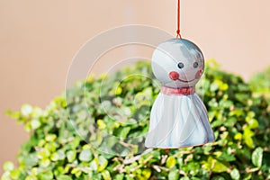 Chasing rain Japanese doll hanging under tree on nature backgroud.It is used to hang or decorate and to drive away evil things