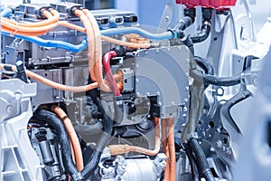 Chassis of the electric car with powertrain and power connections closeup. Blue toned. photo