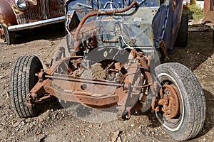 Chassis and firewall of an old pickup is lacking the engine