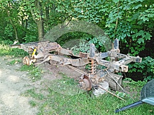 Chassis of old Landrover in grass