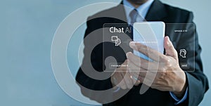 Chat ai concept. Businessman chats with AI on a smartphone. Chatting with a smart artificial intelligence, a customer chatbot