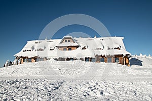 Chata Maraton hut on Lysa hora hill in winter Moravskoslezske Beskydy mountains in Czech republic photo