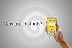 Chatbot concept. Man holding smartphone and using chatting.