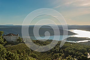 Chateau in Aiguines and St Croix Lake at background, Provence, France