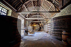 Chateau du Clos de Vougeot. Old casks of a winery. Cote de Nuits, Burgundy, France.