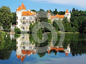 Chateau mirroring in a lake