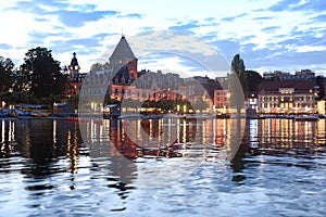 Chateau Ouchy ChÃ¢teau d`Ouchy on Lake Geneva promenade at eve