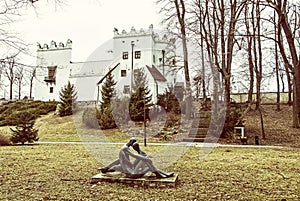 Chateau Strazky and statue of lovers, yellow filter