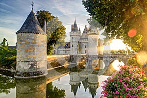 The chateau of Sully-sur-Loire in the sunlight with lens flare,