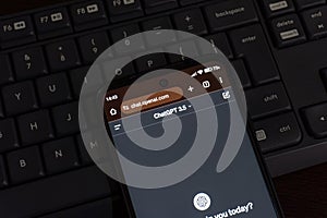 ChatGPT, a prototype AI chatbot, is seen on the website of OpenAI, on a smartphone