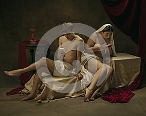 Modern remake of classical artwork with modern tech theme - young medieval couple on dark background