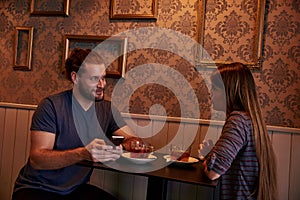 Chatting young couple in a pub